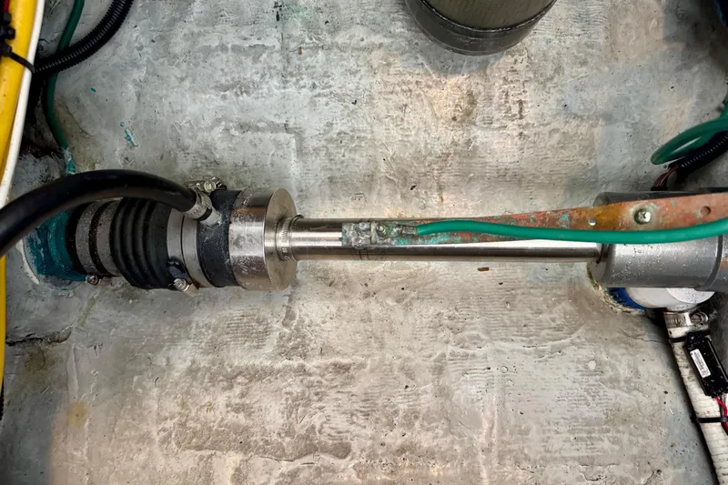 Tui Yacht Photos Pics Close-up of a 2005 Back Cove 29 boat's propeller shaft and surrounding components.