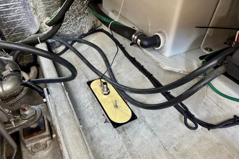 Tui Yacht Photos Pics Engine compartment of a 2005 Back Cove 29 boat, showing wiring and components.