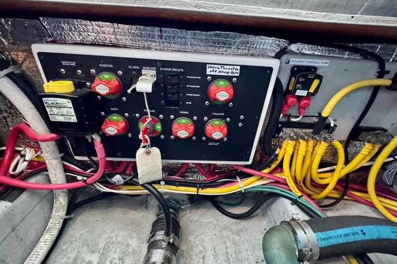 Tui Yacht Photos Pics Electrical panel of a 2005 Back Cove 29 boat with labeled switches and wiring.
