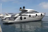 Luxury 2010 Pershing 56 yacht docked in a marina, sleek design and modern features.
