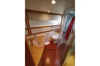 Luxurious bathroom in 2010 Pershing 56 yacht with modern fixtures and elegant design.