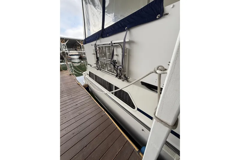  Yacht Photos Pics Side view of 1994 Tollycraft 45 Cockpit Motor Yacht docked at marina.