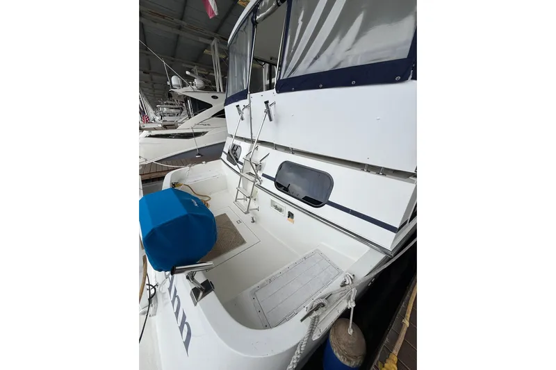  Yacht Photos Pics 1994 Tollycraft 45 Cockpit Motor Yacht, docked, featuring spacious cockpit and covered seating area.