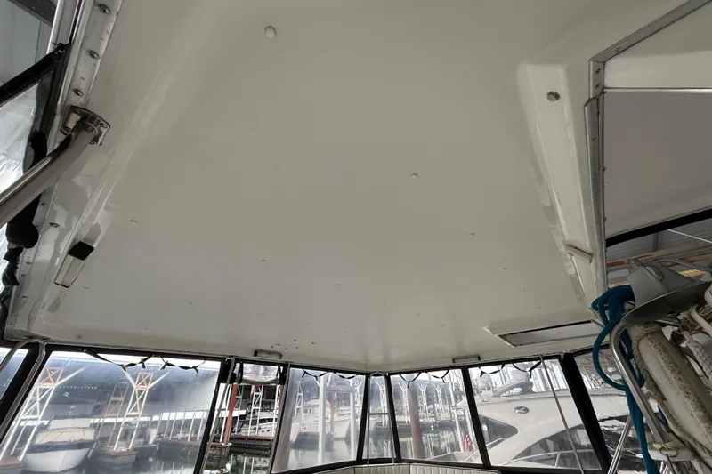  Yacht Photos Pics Interior view of 1994 Tollycraft 45 Cockpit Motor Yacht with marina background.