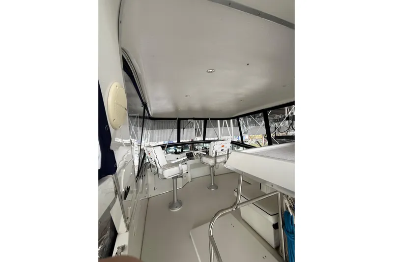  Yacht Photos Pics 1994 Tollycraft 45 Cockpit Motor Yacht interior with helm and seating area.