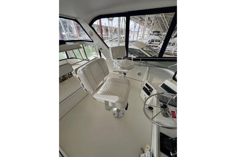  Yacht Photos Pics 1994 Tollycraft 45 Cockpit Motor Yacht interior with helm and seating area.