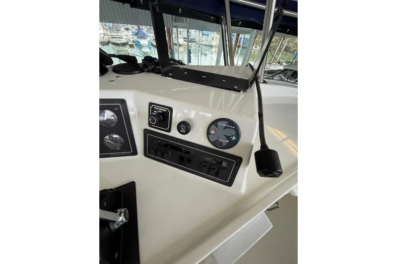  Yacht Photos Pics 1994 Tollycraft 45 Cockpit Motor Yacht helm controls with gauges and switches.