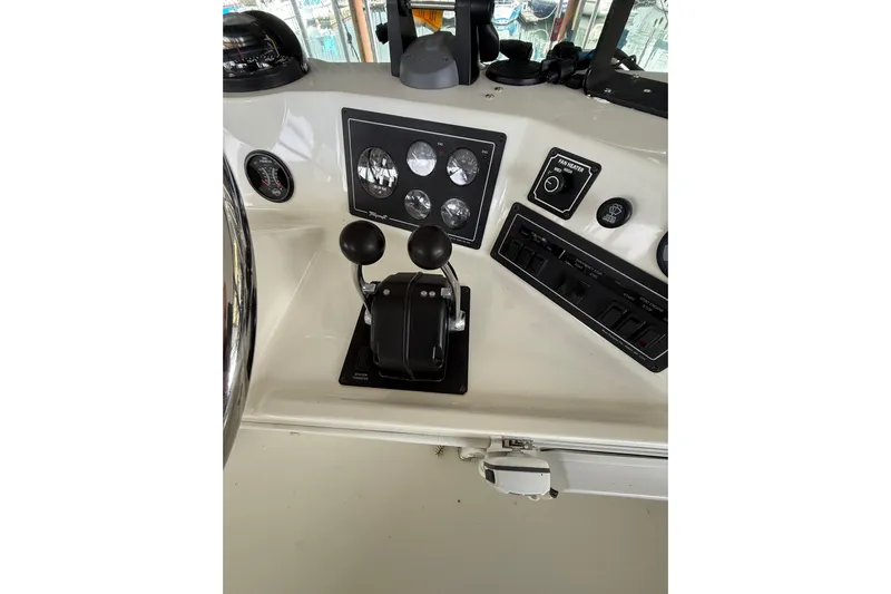  Yacht Photos Pics Control panel of 1994 Tollycraft 45 Cockpit Motor Yacht with gauges and levers.