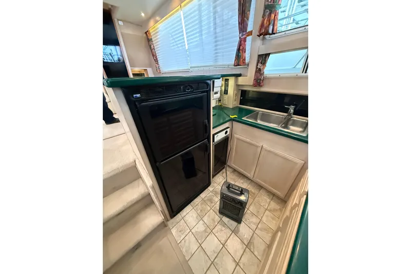  Yacht Photos Pics 1994 Tollycraft 45 Cockpit Motor Yacht kitchen with appliances and sink.