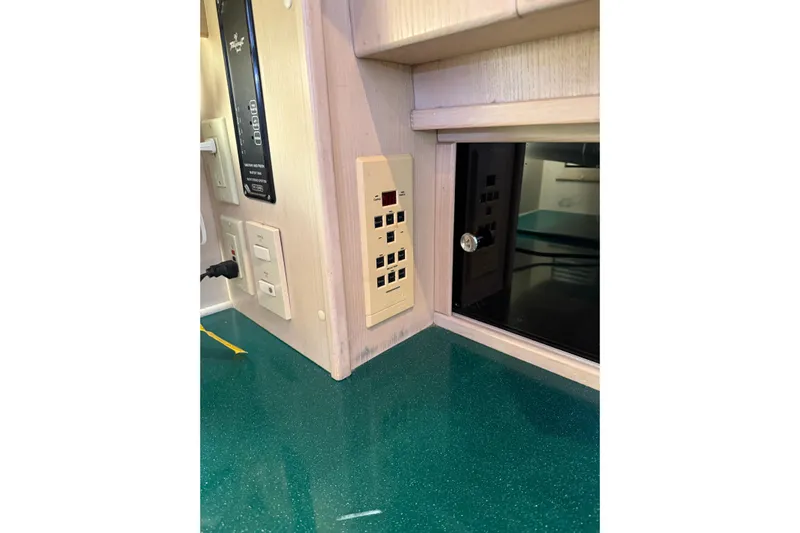  Yacht Photos Pics 1994 Tollycraft 45 Cockpit Motor Yacht interior with control panel and outlets.