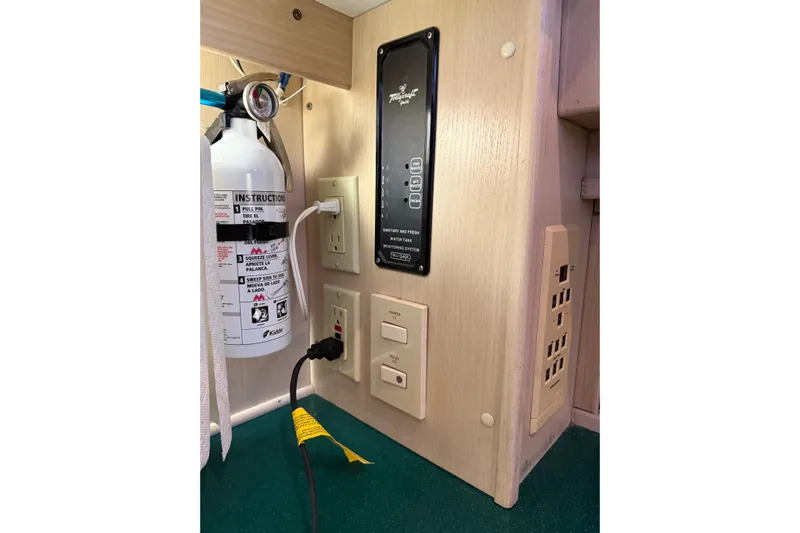  Yacht Photos Pics 1994 Tollycraft 45 Cockpit Motor Yacht interior with control panel and fire extinguisher.