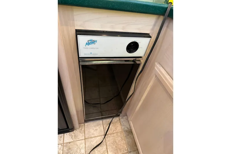  Yacht Photos Pics Trash compactor in 1994 Tollycraft 45 Cockpit Motor Yacht kitchen area.