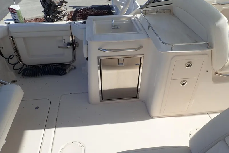  Yacht Photos Pics 2021 Grady-White Freedom 285 boat interior with sink and storage compartments.