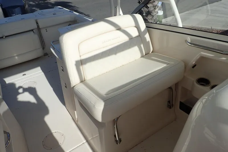  Yacht Photos Pics 2021 Grady-White Freedom 285 boat interior with white seating and cup holders.
