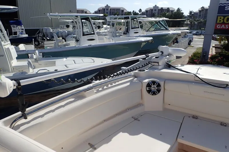  Yacht Photos Pics 2021 Grady-White Freedom 285 boat displayed at a marina with other vessels.