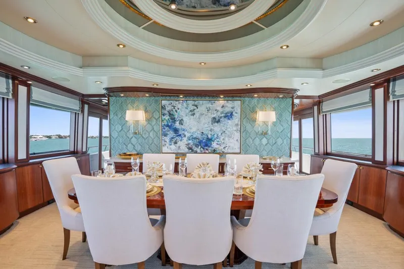 Risk And Reward Yacht Photos Pics Luxurious dining area on 2004 Crescent Raised Pilothouse yacht with elegant decor and ocean views.