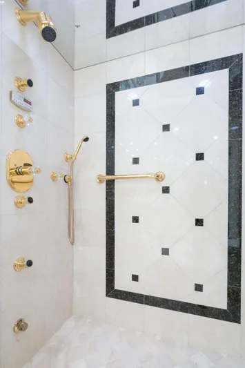 Risk And Reward Yacht Photos Pics Luxurious shower with gold fixtures and elegant black-and-white tile design, Crescent Raised Pilothouse 2004.