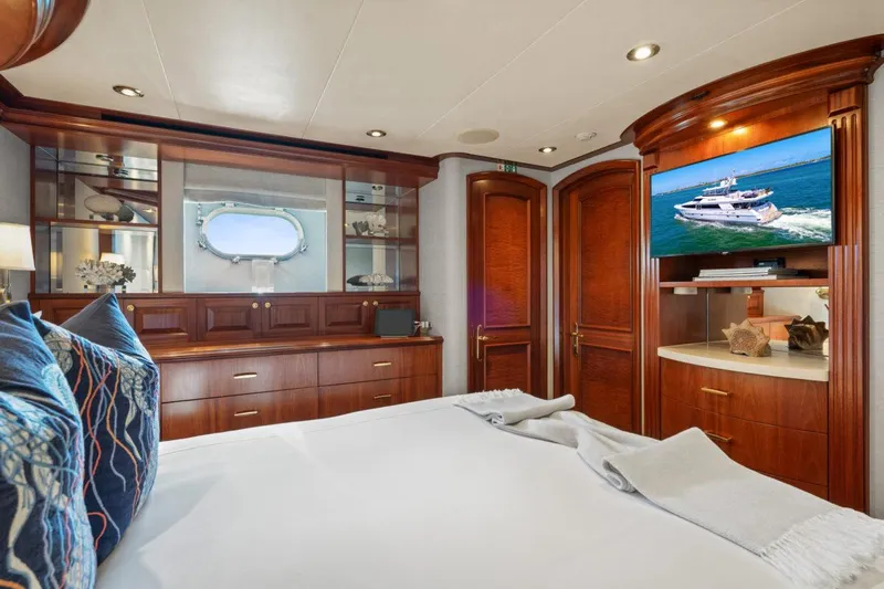 Risk And Reward Yacht Photos Pics Luxurious bedroom interior on 2004 Crescent Raised Pilothouse yacht with elegant wood finishes.