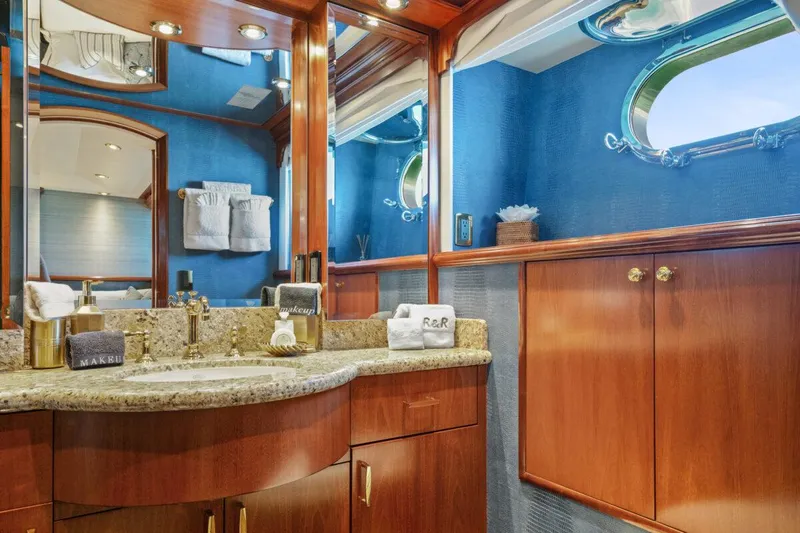 Risk And Reward Yacht Photos Pics Luxurious bathroom in 2004 Crescent Raised Pilothouse yacht with elegant wood cabinetry and granite countertop.
