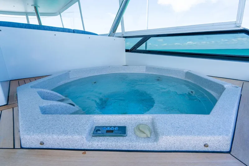 Risk And Reward Yacht Photos Pics Luxurious hot tub on 2004 Crescent Raised Pilothouse yacht deck with ocean view.