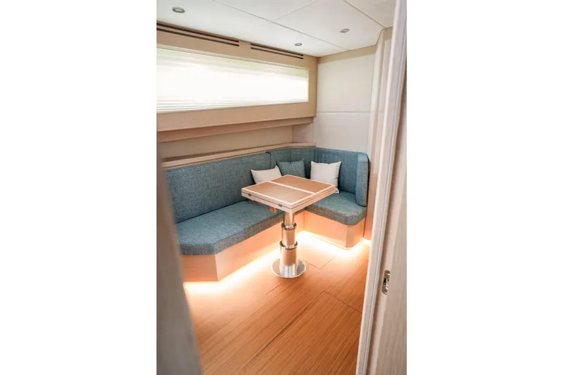 Viviendo Yacht Photos Pics 2024 Lancia Aprea 52 interior with cozy seating and modern table design.