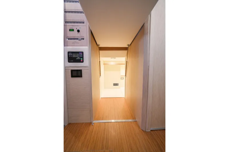 Viviendo Yacht Photos Pics Interior view of 2024 Lancia Aprea 52, featuring modern control panels and wood flooring.