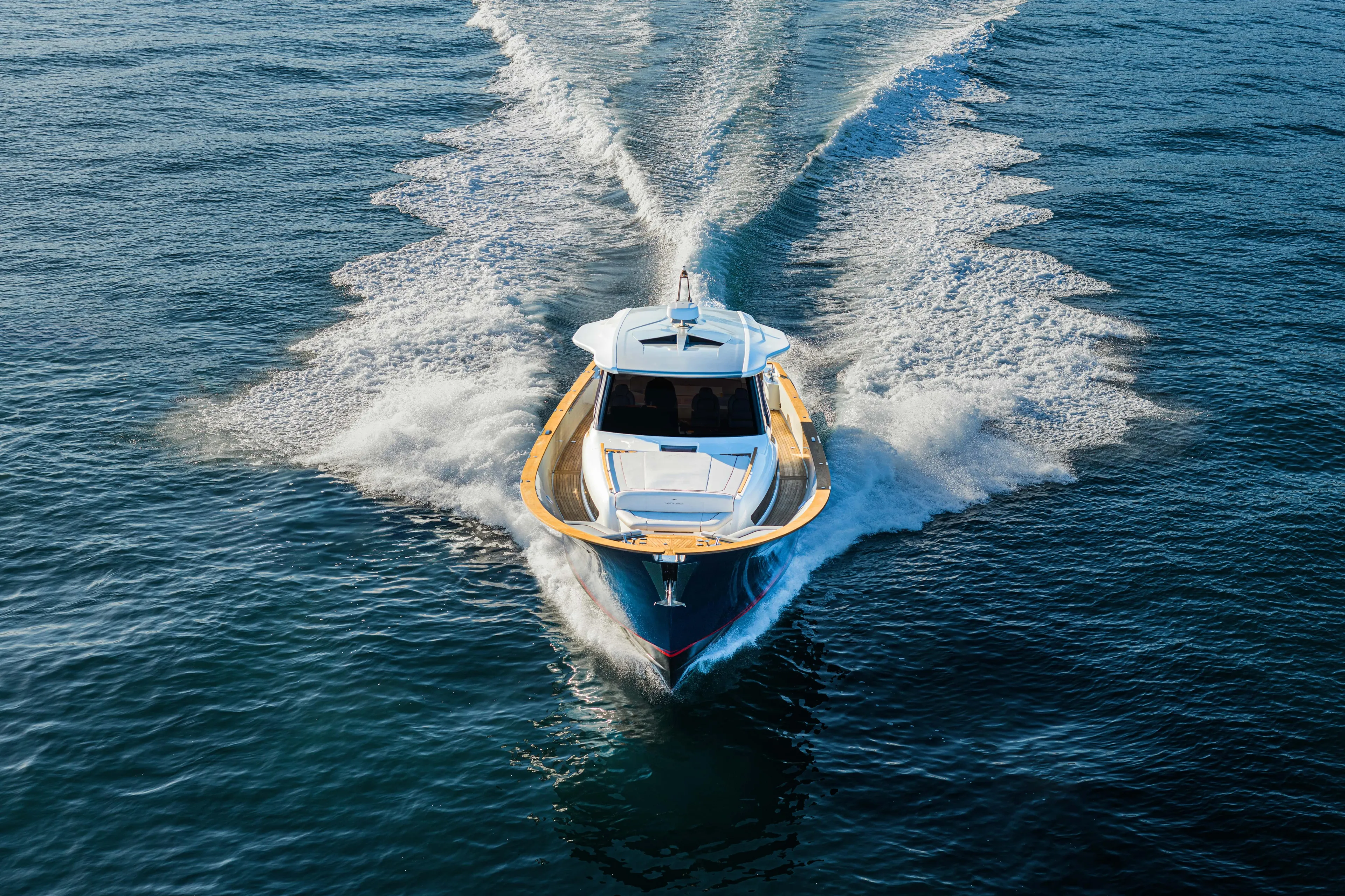 Viviendo Yacht Photos Pics 2024 Lancia Aprea 52 yacht cruising on open water, creating a dynamic wake.