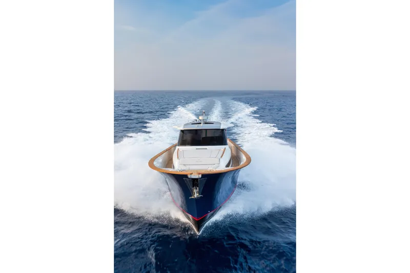 Viviendo Yacht Photos Pics 2024 Lancia Aprea 52 yacht cruising on open sea, showcasing sleek design and performance.