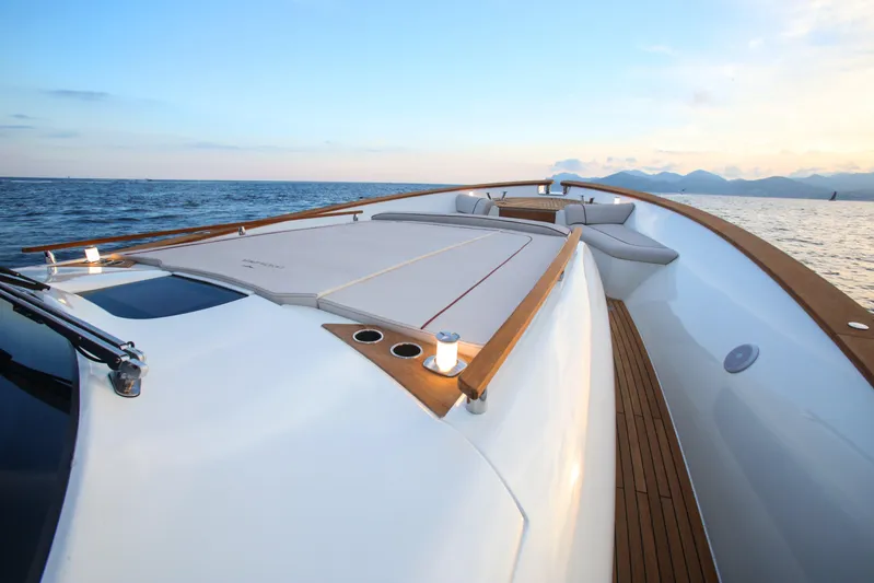 Viviendo Yacht Photos Pics 2024 Lancia Aprea 52 yacht on open sea, featuring sleek deck design and luxurious seating.