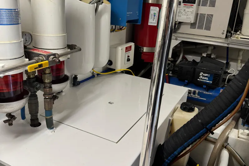 Glomar I Yacht Photos Pics Engine room of 2004 Hatteras 60 Convertible yacht with fuel filters and equipment.