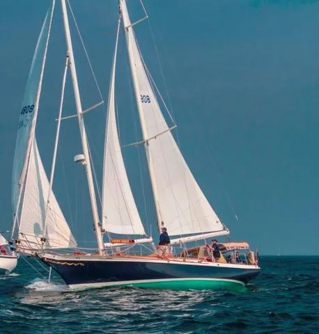 Light Reign Yacht Photos Pics Cherubini Schooner 2000 sailing on open water with full sails.