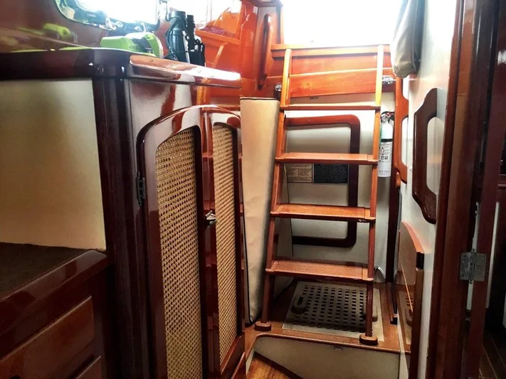 Light Reign Yacht Photos Pics Interior of 2000 Cherubini Schooner with wooden ladder and cabinetry.