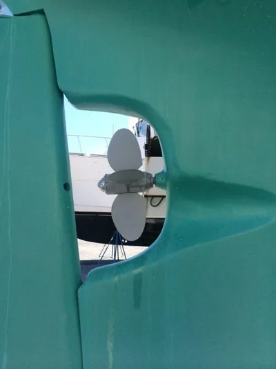 Light Reign Yacht Photos Pics Propeller of 2000 Cherubini Schooner in dry dock, viewed through hull opening.