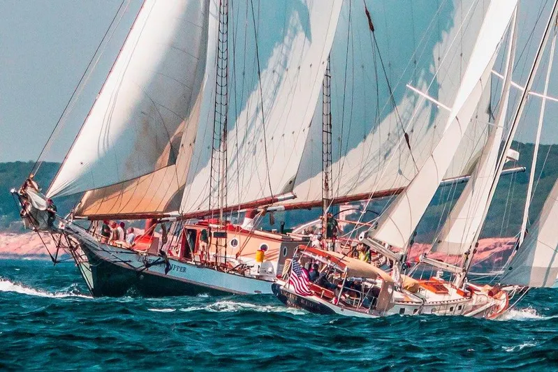 Light Reign Yacht Photos Pics Cherubini Schooner 2000 sailing on open sea with full sails and crew.