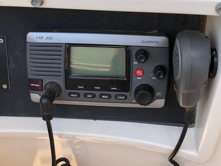Light Reign Yacht Photos Pics VHF 200 Garmin radio on 2000 Cherubini Schooner, featuring microphone and control panel.