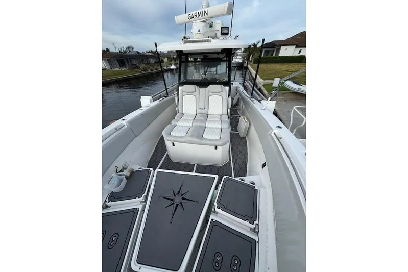 Yacht Photos Pics 2021 Sea Fox 368 Commander boat interior with cushioned seating and Garmin equipment.