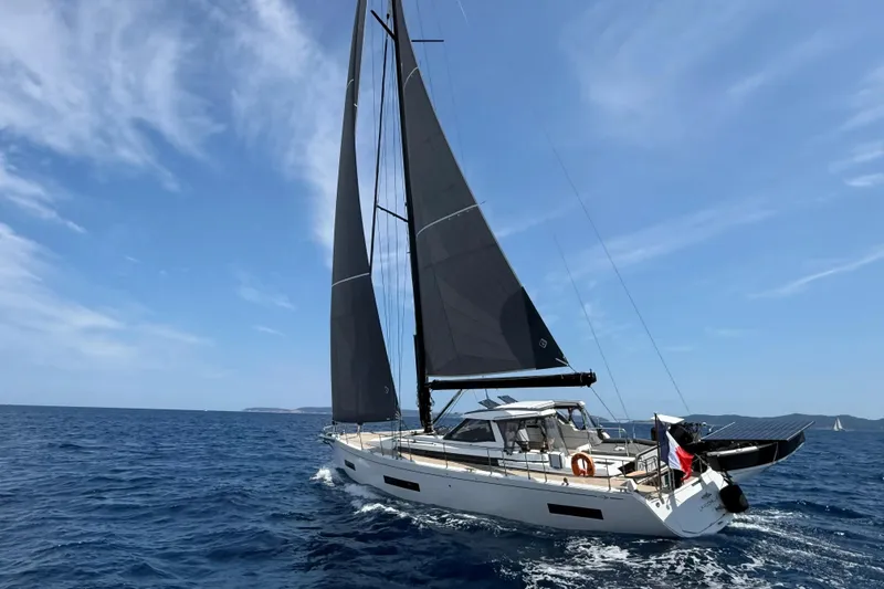  Yacht Photos Pics Sailing yacht Amel 50, 2025 model, cruising on open sea under clear skies.
