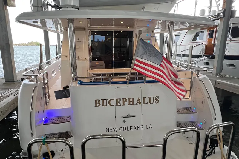 Bucephulas Yacht Photos Pics 2012 Hampton motor yacht docked, displaying an American flag, named "Bucephalus" from New Orleans.