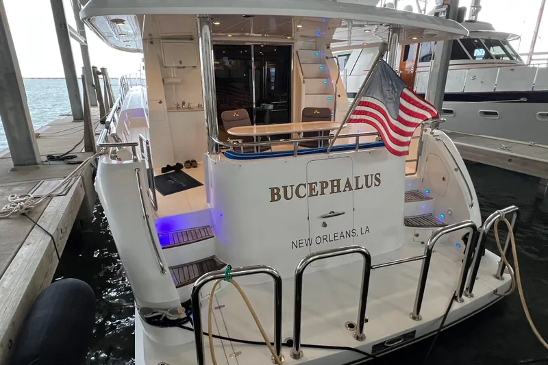 Bucephulas Yacht Photos Pics 2012 Hampton motor yacht docked, displaying "Bucephalus" and American flag, New Orleans.