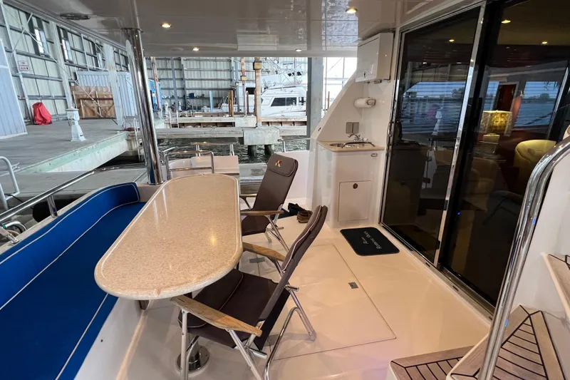 Bucephulas Yacht Photos Pics Luxurious 2012 Hampton motor yacht interior with dining area and modern amenities.