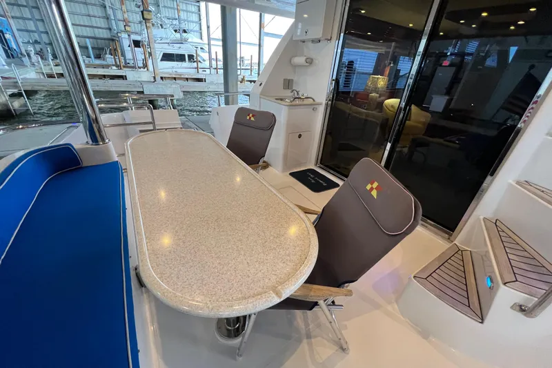 Bucephulas Yacht Photos Pics Luxurious 2012 Hampton motor yacht interior with elegant seating and dining area.