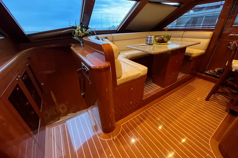 Bucephulas Yacht Photos Pics Luxurious 2012 Hampton motor yacht interior with elegant wood finish and plush seating.