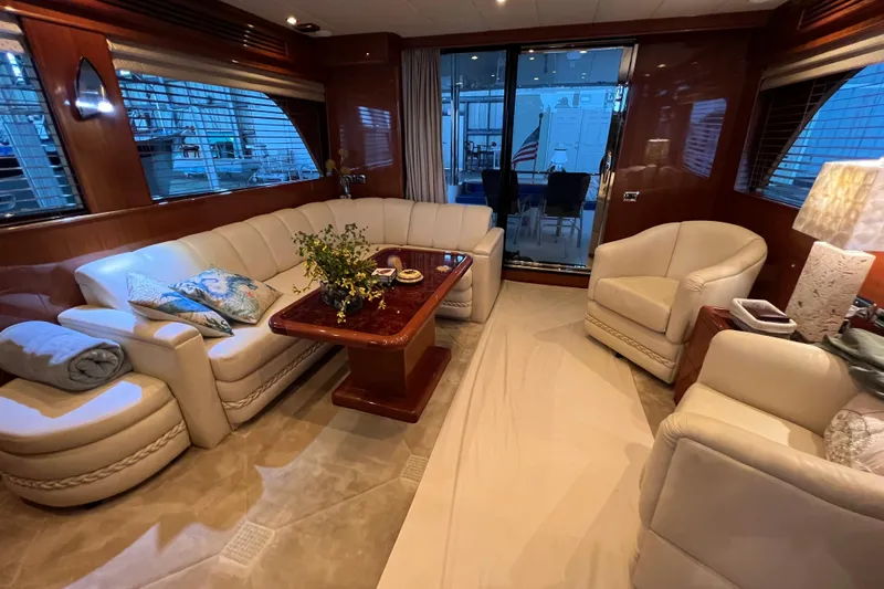 Bucephulas Yacht Photos Pics Luxurious 2012 Hampton motor yacht interior with elegant seating and wooden accents.