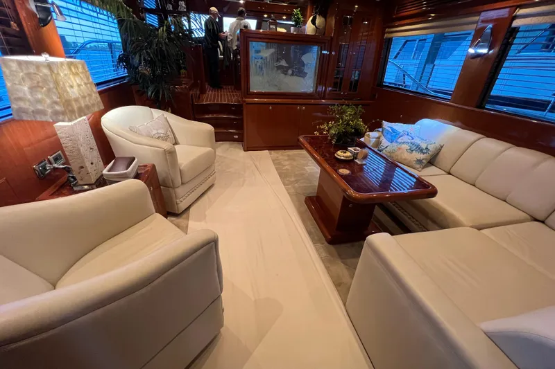Bucephulas Yacht Photos Pics Luxurious 2012 Hampton motor yacht interior with elegant seating and wooden accents.