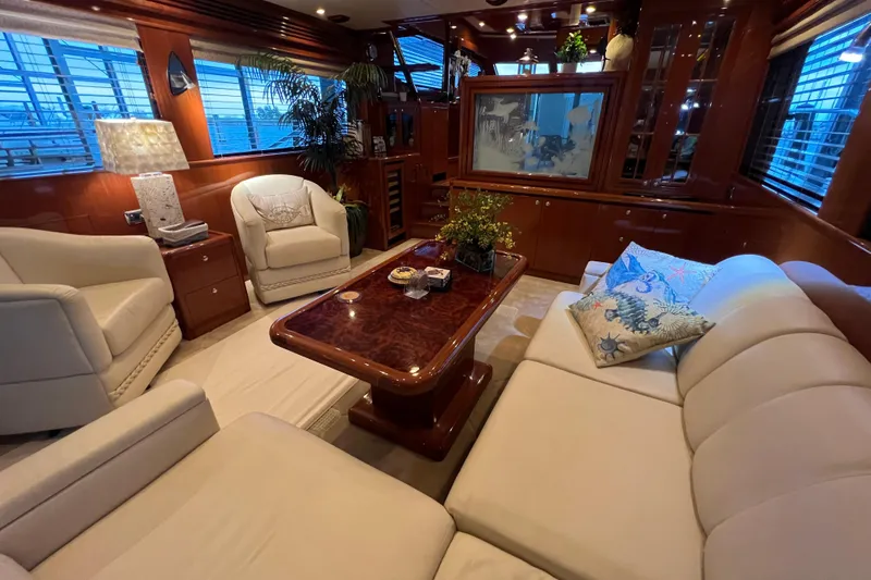 Bucephulas Yacht Photos Pics Luxurious interior of a 2012 Hampton motor yacht with elegant seating and decor.