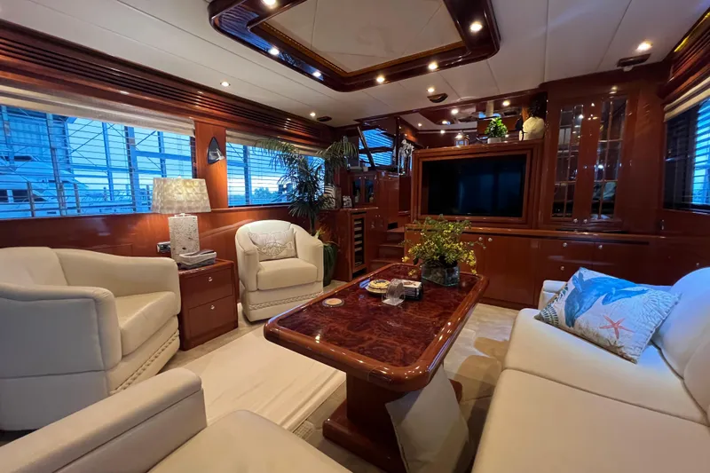 Bucephulas Yacht Photos Pics Luxurious 2012 Hampton motor yacht interior with elegant seating and wooden accents.