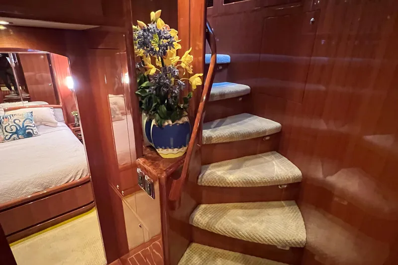 Bucephulas Yacht Photos Pics Luxurious 2012 Hampton motor yacht interior with elegant staircase and cozy bedroom.