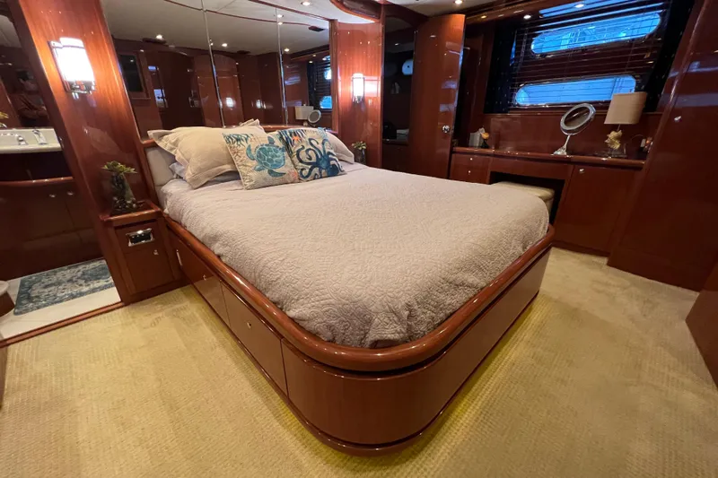 Bucephulas Yacht Photos Pics Luxurious bedroom interior of 2012 Hampton motor yacht with elegant wood finishes.