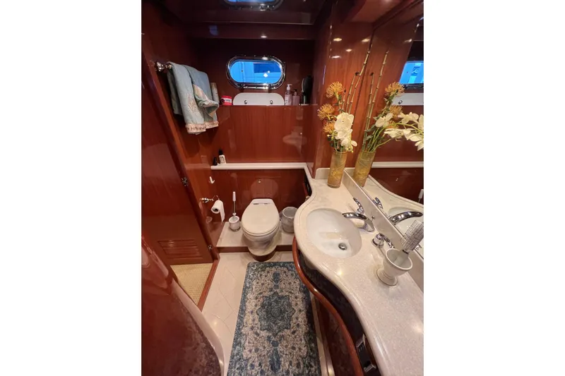 Bucephulas Yacht Photos Pics Luxurious 2012 Hampton motor yacht bathroom with elegant wood finish and floral decor.