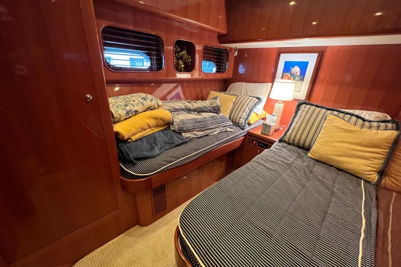 Bucephulas Yacht Photos Pics Luxurious 2012 Hampton motor yacht cabin with twin beds and elegant wood paneling.
